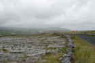 Karst pavements and topography of the Burren approx 5km south of Ballyvaughan Co Clare Ireland. Exposures of the Dinantian Burren Limestone Formation are composed of shallow water carbonates. Note the clints (limestone blocks) and grikes (joints formed by Variscan folding (Coller, 1984) and fracturing) enlarged by Pleistocene disolution (Williams, 1966).